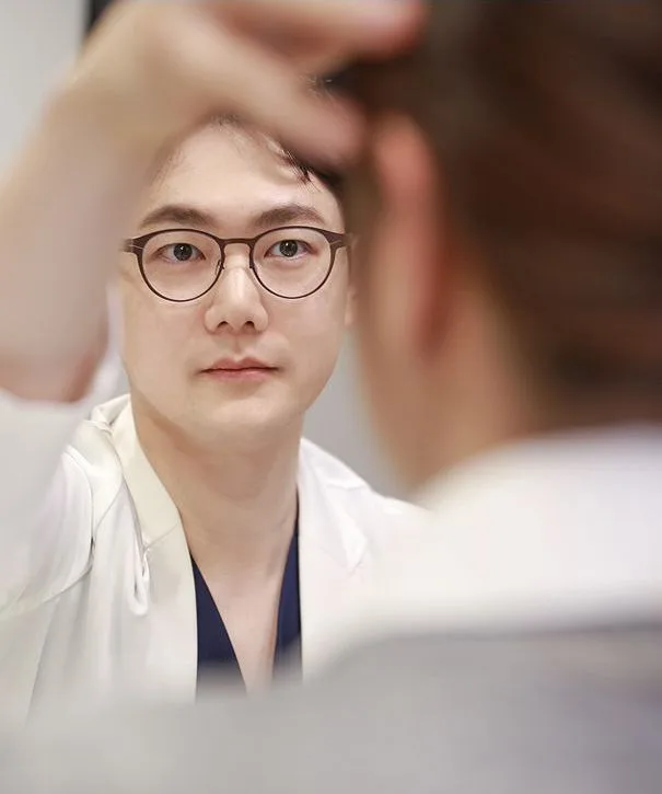 Dr. Chang Min Kang examining the under-eye area
